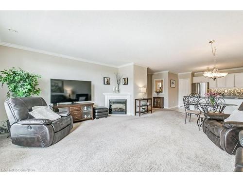 409-1998 Ironstone Drive, Burlington, ON - Indoor Photo Showing Living Room With Fireplace