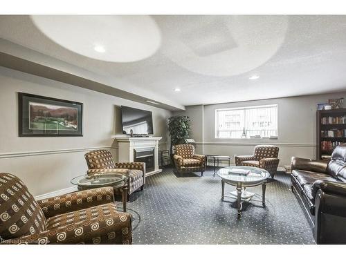 409-1998 Ironstone Drive, Burlington, ON - Indoor Photo Showing Living Room With Fireplace