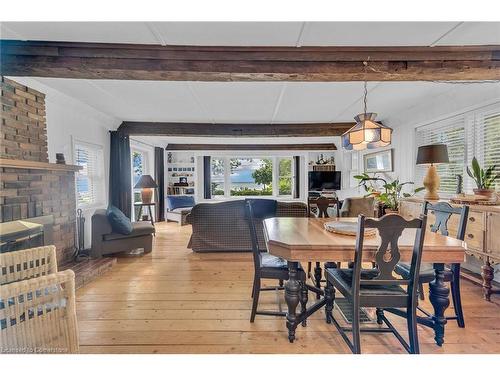 2593 North Shore Drive, Lowbanks, ON - Indoor Photo Showing Dining Room With Fireplace