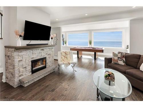 2952 North Shore Drive, Lowbanks, ON - Indoor Photo Showing Living Room With Fireplace