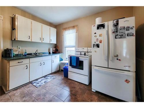 11 Carlton Street, St. Catharines, ON - Indoor Photo Showing Kitchen With Double Sink