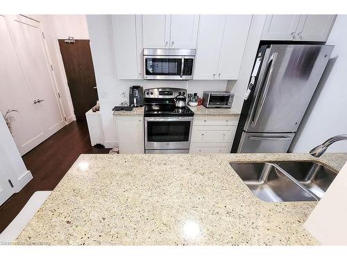 410-112 King Street E, Hamilton, ON - Indoor Photo Showing Kitchen With Double Sink