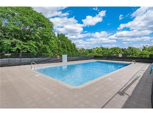 1008-2055 Upper Middle Road, Burlington, ON - Outdoor With In Ground Pool