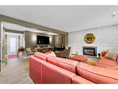 8371 Ares Court, Niagara Falls, ON - Indoor Photo Showing Living Room With Fireplace