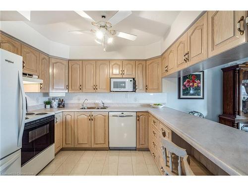 507-500 Green Road, Stoney Creek, ON - Indoor Photo Showing Kitchen With Double Sink