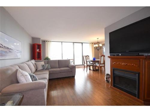 1610-2055 Upper Middle Road, Burlington, ON - Indoor Photo Showing Living Room With Fireplace