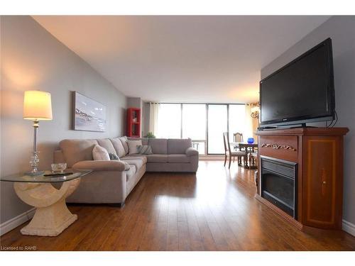 1610-2055 Upper Middle Road, Burlington, ON - Indoor Photo Showing Living Room With Fireplace