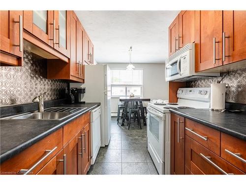 211-485 Thorold Road, Welland, ON - Indoor Photo Showing Kitchen With Double Sink