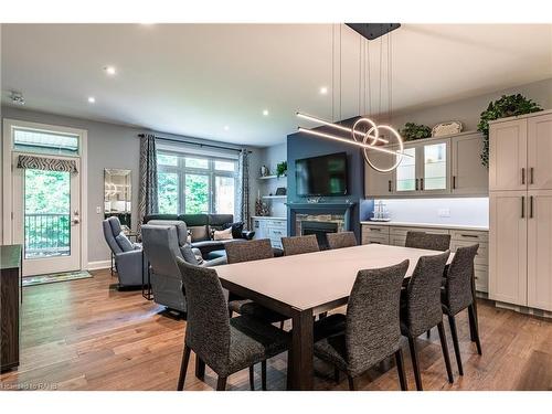 2-9245 Shoveller Drive, Niagara Falls, ON - Indoor Photo Showing Dining Room With Fireplace