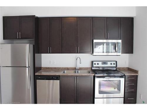 401-2486 Old Bronte Road, Oakville, ON - Indoor Photo Showing Kitchen With Double Sink With Upgraded Kitchen