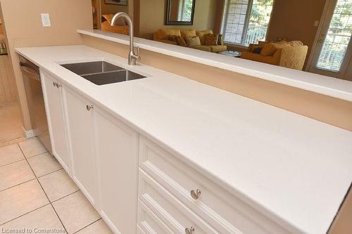 C205-216 Plains Road W, Burlington, ON - Indoor Photo Showing Kitchen With Double Sink