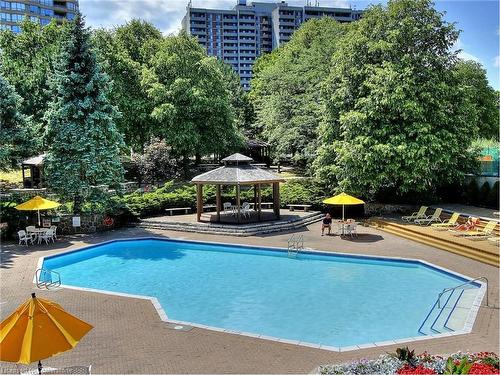 330-25 Bamburgh Circle, Toronto, ON - Outdoor With In Ground Pool With Backyard