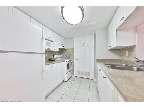 B406-216 Plains Road W, Burlington, ON - Indoor Photo Showing Kitchen With Double Sink