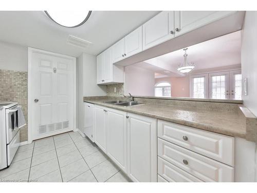 B406-216 Plains Road W, Burlington, ON - Indoor Photo Showing Kitchen With Double Sink