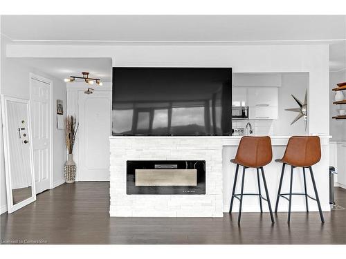 706-40 Harrisford Street, Hamilton, ON - Indoor Photo Showing Living Room With Fireplace