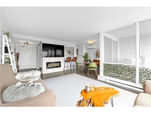 706-40 Harrisford Street, Hamilton, ON - Indoor Photo Showing Living Room With Fireplace