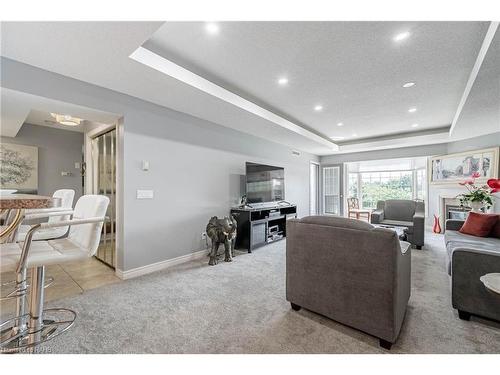 308-990 Golf Links Road, Hamilton, ON - Indoor Photo Showing Other Room With Fireplace