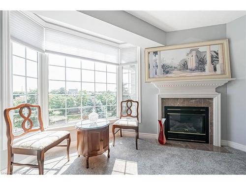 308-990 Golf Links Road, Hamilton, ON - Indoor Photo Showing Living Room With Fireplace