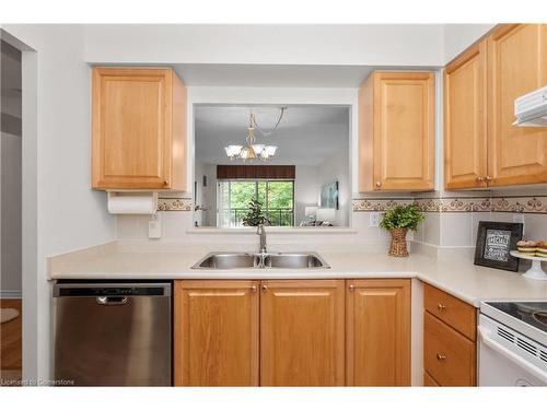 1214-100 Burloak Drive, Burlington, ON - Indoor Photo Showing Kitchen With Double Sink