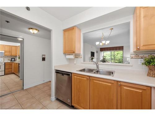 1214-100 Burloak Drive, Burlington, ON - Indoor Photo Showing Kitchen With Double Sink