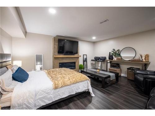 7789 Alpine Drive, Niagara Falls, ON - Indoor Photo Showing Bedroom With Fireplace