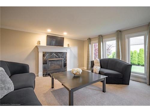 7789 Alpine Drive, Niagara Falls, ON - Indoor Photo Showing Living Room With Fireplace