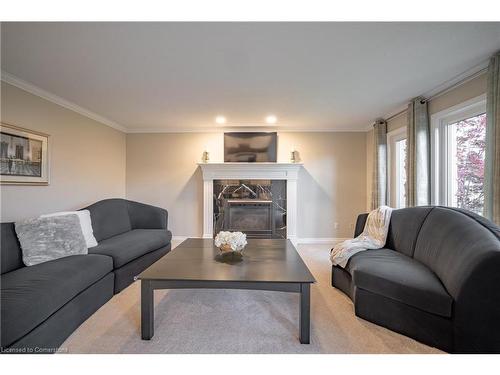 7789 Alpine Drive, Niagara Falls, ON - Indoor Photo Showing Living Room With Fireplace