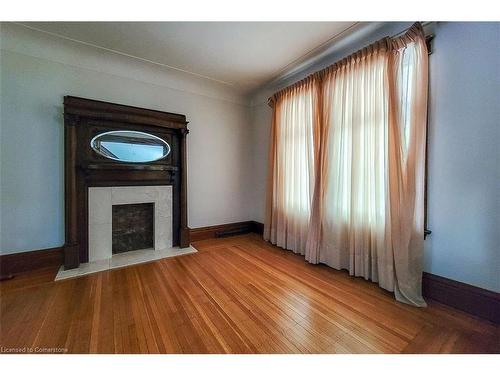 17 Barnesdale Avenue N, Hamilton, ON - Indoor Photo Showing Other Room With Fireplace