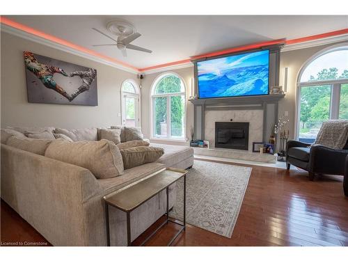 7566 Howard Avenue, Mcgregor, ON - Indoor Photo Showing Living Room With Fireplace