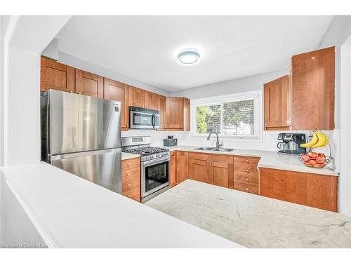 147-2050 Upper Middle Road, Burlington, ON - Indoor Photo Showing Kitchen With Double Sink