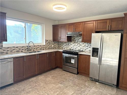 1-688 Dynes Road, Burlington, ON - Indoor Photo Showing Kitchen With Double Sink