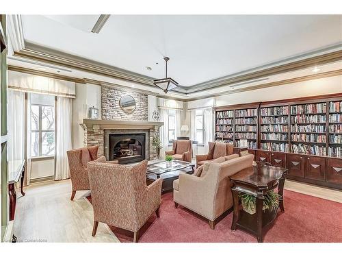 2405-100 Burloak Drive, Burlington, ON - Indoor Photo Showing Living Room With Fireplace