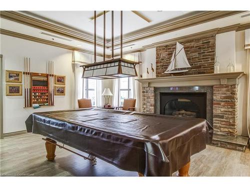 2405-100 Burloak Drive, Burlington, ON - Indoor Photo Showing Other Room With Fireplace