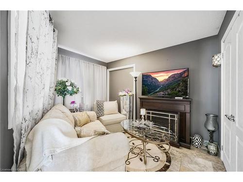 491-493 Dewitt Road, Stoney Creek, ON - Indoor Photo Showing Living Room With Fireplace