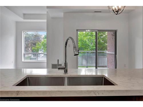 105-5070 Fairview Street, Burlington, ON - Indoor Photo Showing Kitchen With Double Sink