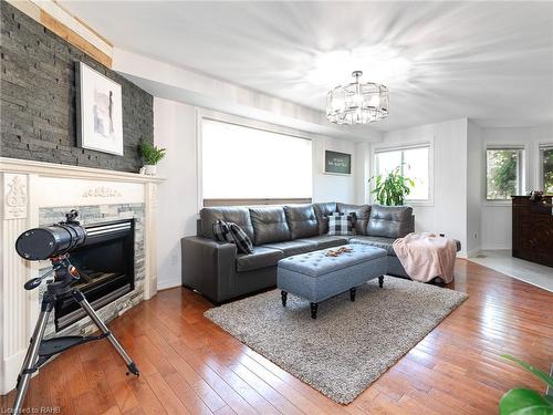 592 Rendezvous Court, Windsor, ON - Indoor Photo Showing Living Room With Fireplace