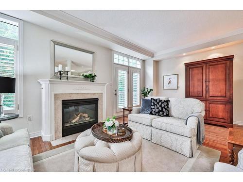 65-1267 Dorval Drive, Oakville, ON - Indoor Photo Showing Living Room With Fireplace