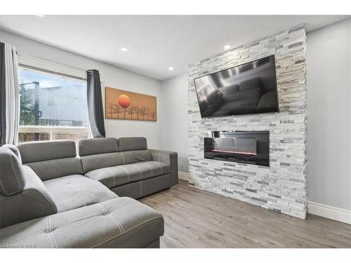 59-39 Pinewoods Drive, Stoney Creek, ON - Indoor Photo Showing Living Room With Fireplace