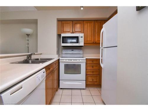 1508-1276 Maple Crossing Boulevard, Burlington, ON - Indoor Photo Showing Kitchen With Double Sink