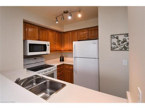 1508-1276 Maple Crossing Boulevard, Burlington, ON - Indoor Photo Showing Kitchen With Double Sink