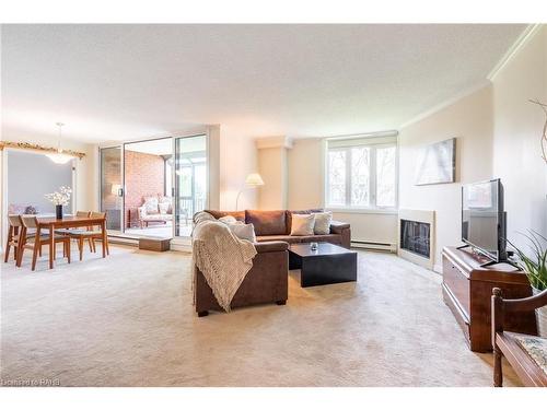 305-150 Wilson Street W, Ancaster, ON - Indoor Photo Showing Living Room With Fireplace