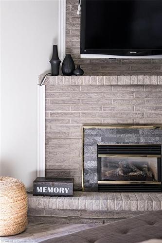 22-1155 Paramount Drive, Stoney Creek, ON - Indoor Photo Showing Living Room With Fireplace