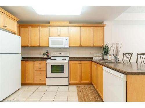 216-125 Wilson Street W, Ancaster, ON - Indoor Photo Showing Kitchen With Double Sink