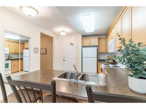 216-125 Wilson Street W, Ancaster, ON - Indoor Photo Showing Kitchen With Double Sink