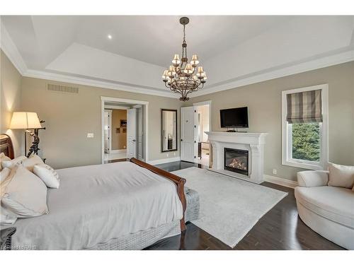 5100 14 Side Road, Milton, ON - Indoor Photo Showing Bedroom With Fireplace