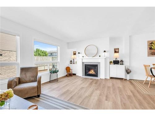 10-2050 Upper Middle Road, Burlington, ON - Indoor Photo Showing Living Room With Fireplace