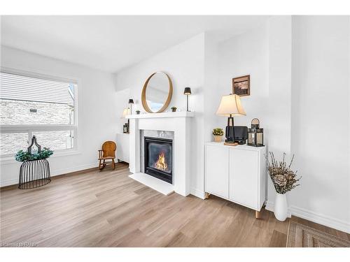 10-2050 Upper Middle Road, Burlington, ON - Indoor Photo Showing Living Room With Fireplace