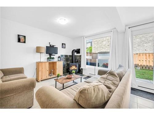 10-2050 Upper Middle Road, Burlington, ON - Indoor Photo Showing Living Room With Fireplace