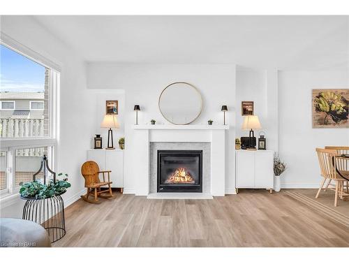 10-2050 Upper Middle Road, Burlington, ON - Indoor Photo Showing Living Room With Fireplace