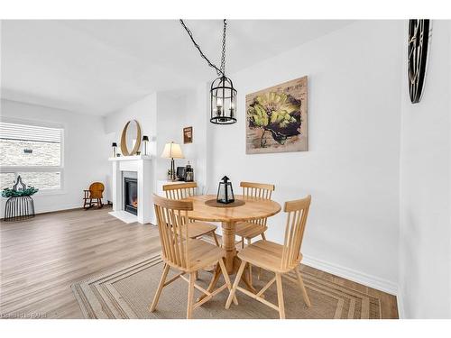 10-2050 Upper Middle Road, Burlington, ON - Indoor Photo Showing Dining Room With Fireplace